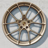 20/21-inch 911 Carrera lightweight wheel set painted in Neodyme.
